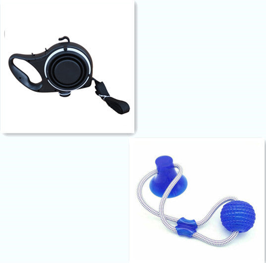 Retractable dog leash with black handle and blue ball on a white background