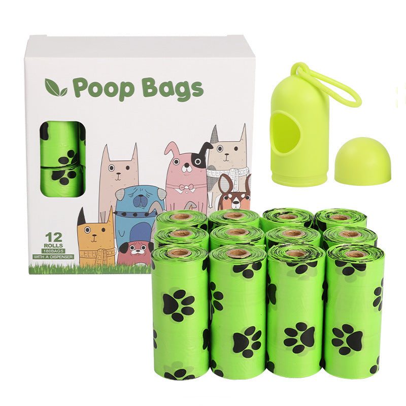 Dog poop bags with packaging and a green bag holder on a white background
