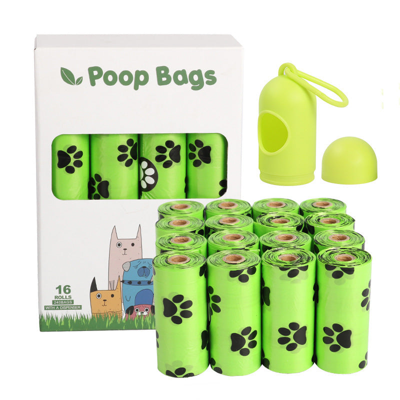 Dog poop bags with packaging and a green bag holder on a white background
