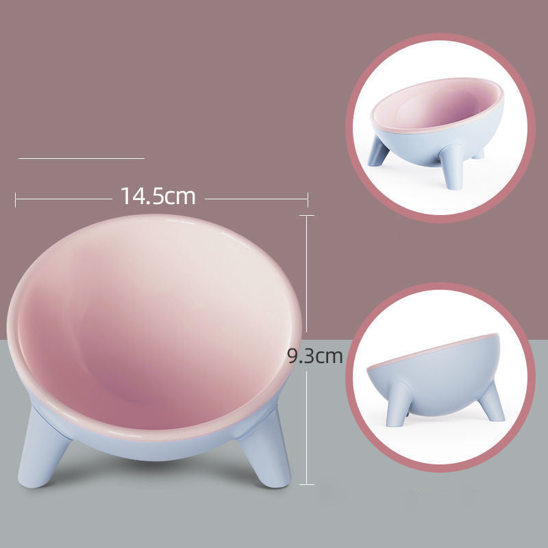 Small pink and blue bowl with dimensions on a gray background