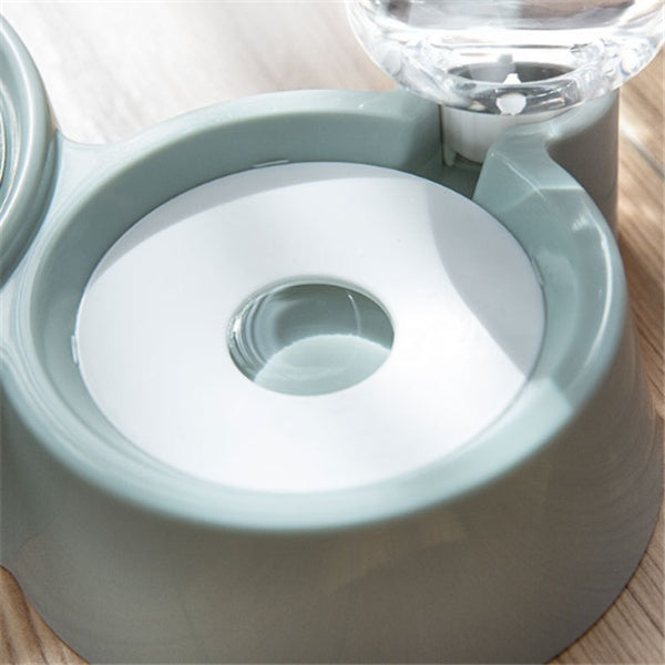 Light blue pet water fountain on a wooden surface