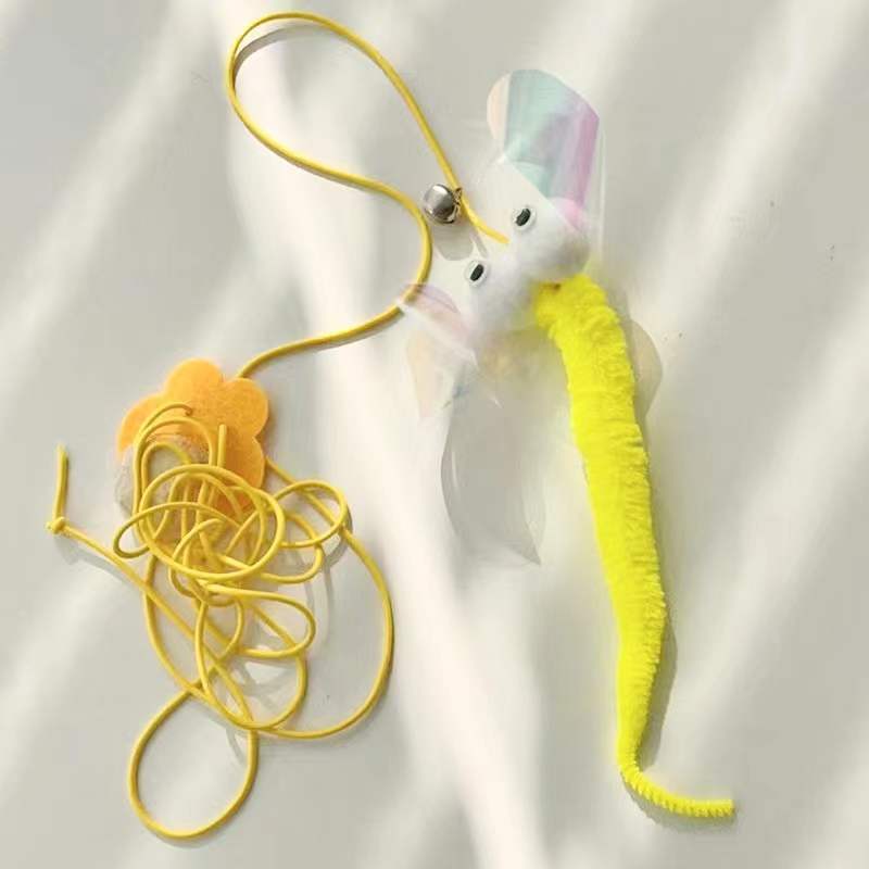 Toy figure with a long yellow tail and a small head on a white background