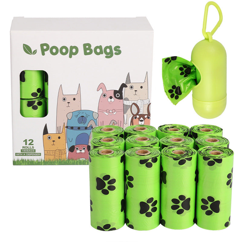 Dog poop bags with packaging and a green bag holder on a white background
