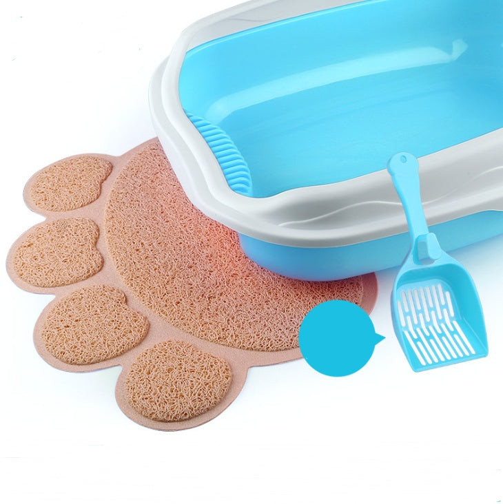 Cat litter box with a scoop and foot-shaped mat on a white background