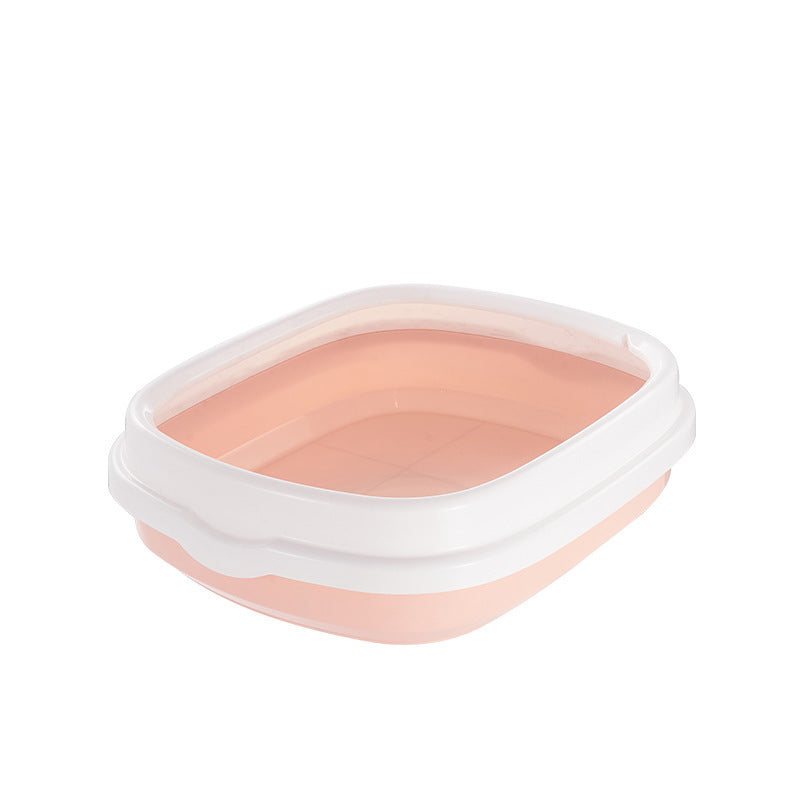 Pink pet bowl with white rim on a white background