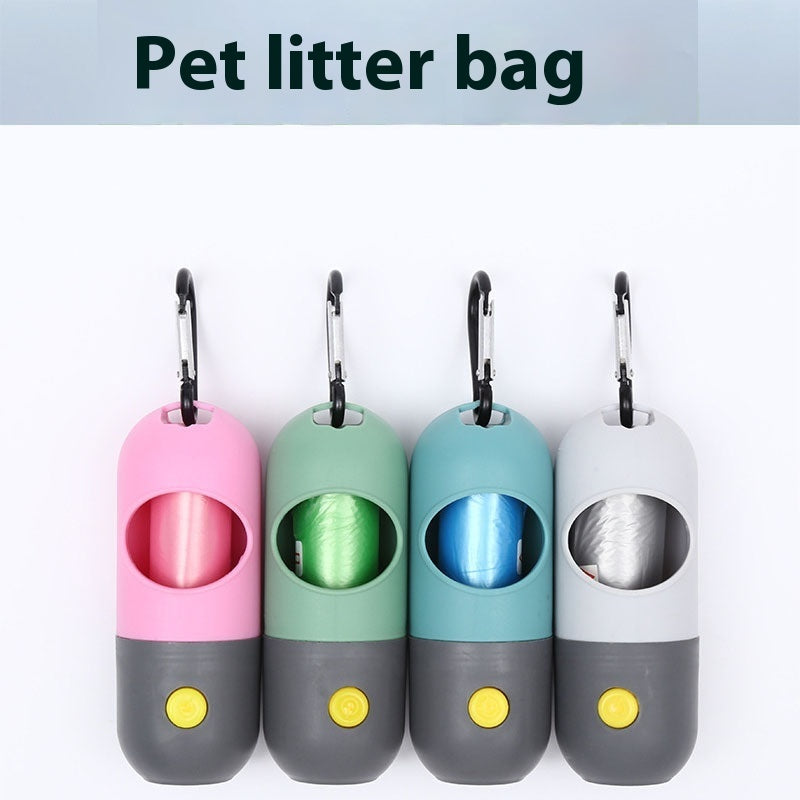 Four pet litter bags with colorful tops and gray bases on a white background.