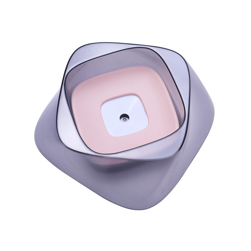Pet water feeder with a pink center and purple outer shell on a white background