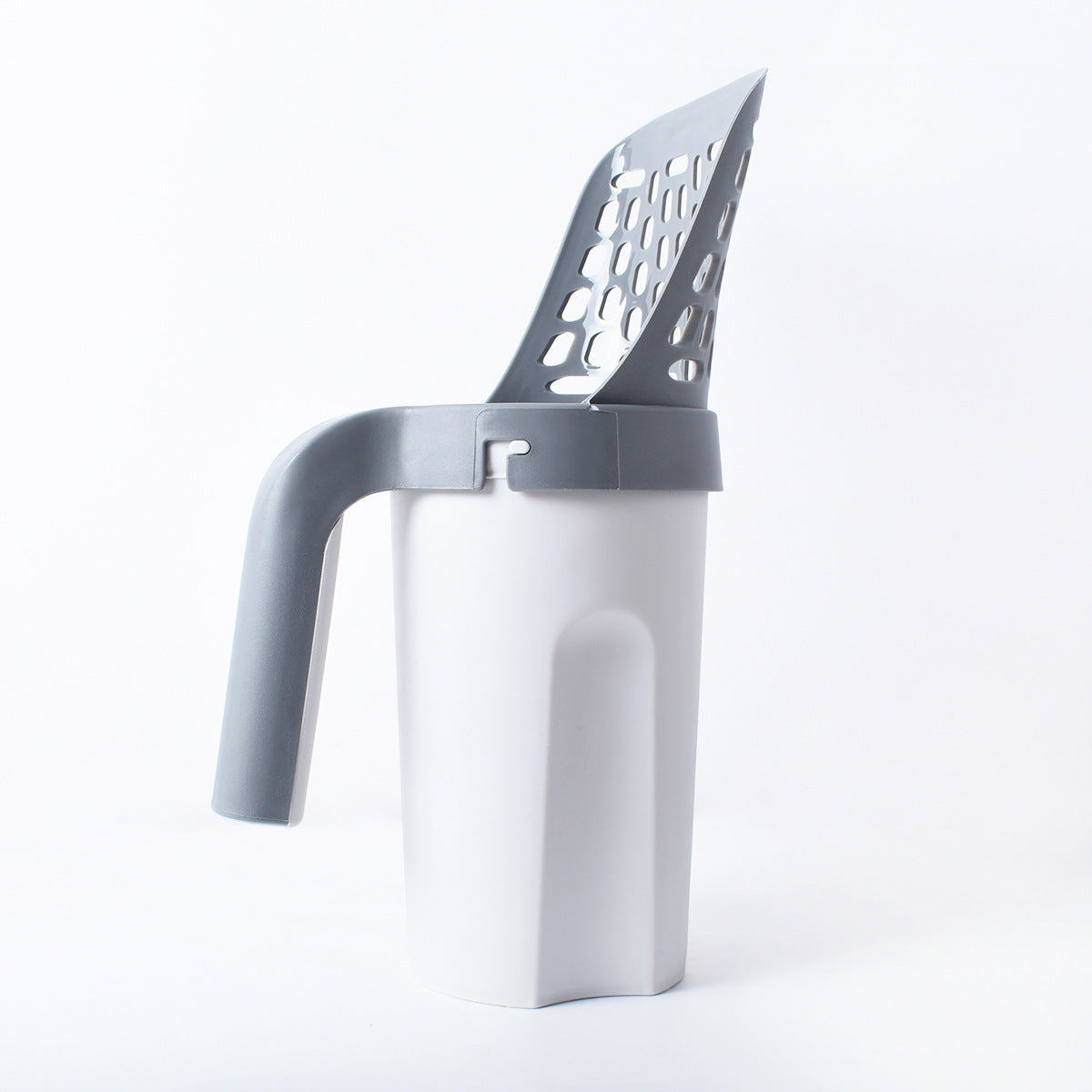 Cat litter scoop in a white background