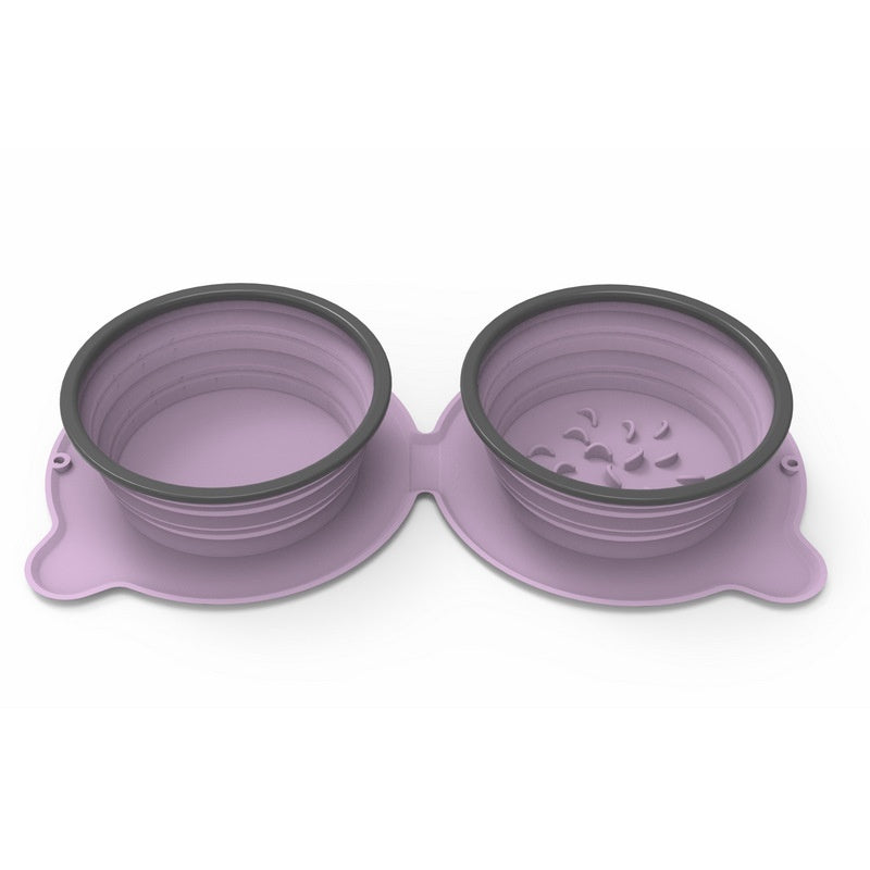 Purple silicone pet bowls with black rims on a white background