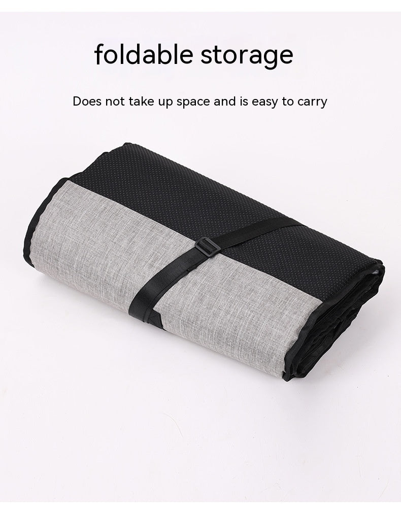 Folded pet carry bag with black and gray design on a white background