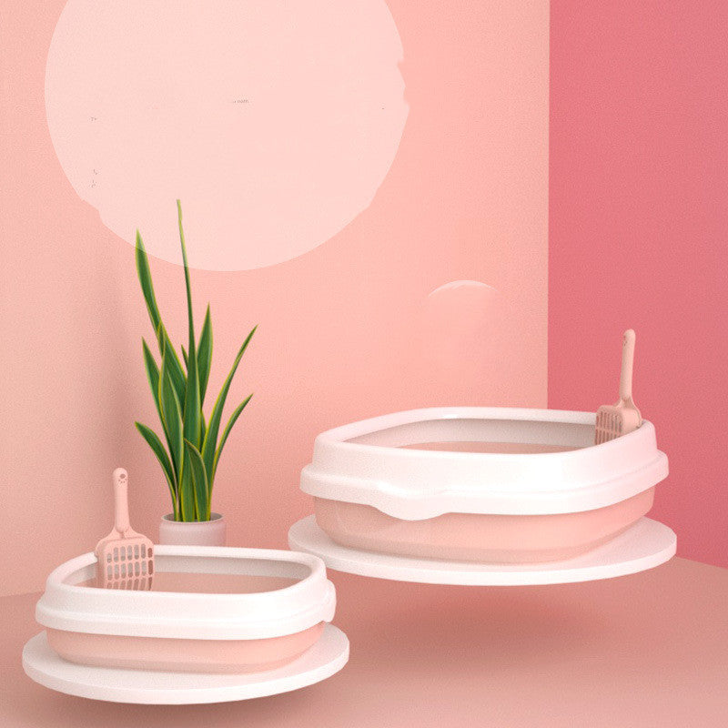 White pet bowls and pink pet scoops on a pink background