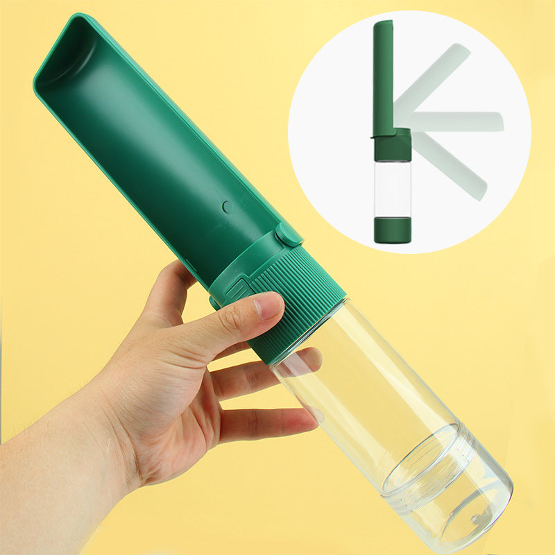 Green handheld water bottle with a clear drinking tube on a yellow background