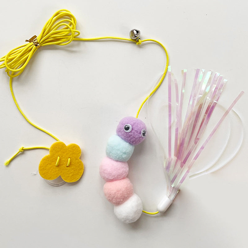 Cat toy with colorful caterpillar-shaped pom-pom and yellow string on a white background