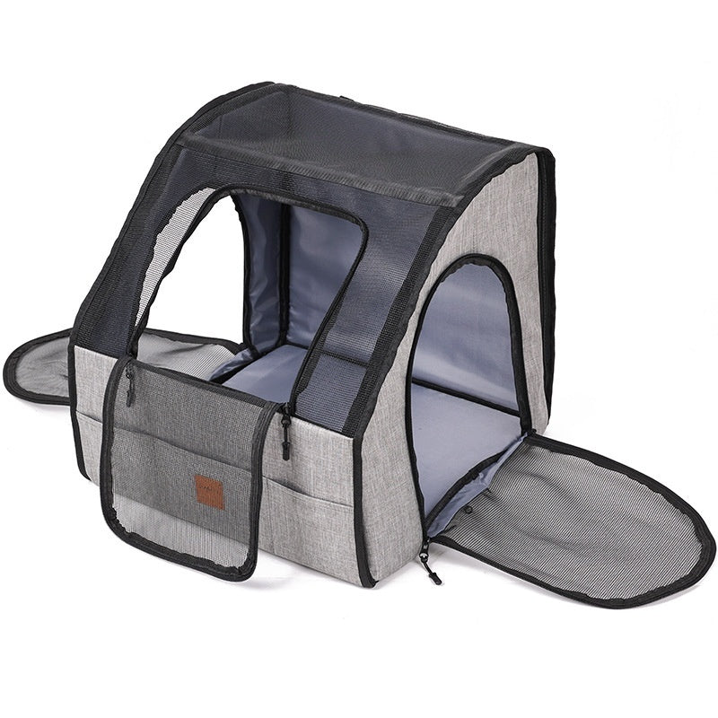 Gray pet carrier with mesh sides on a white background
