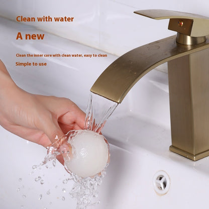 Gold faucet with water flowing, hand washing the tool, on a white background.