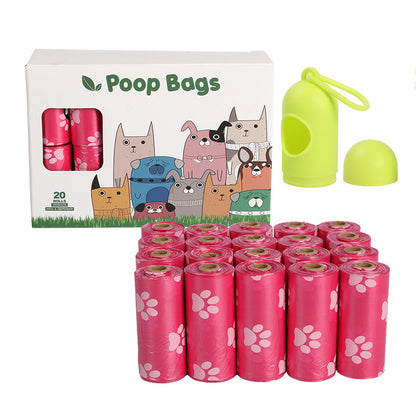 Dog poop bags with a packaging box featuring cartoon dogs and a green waste bag holder on a white background.