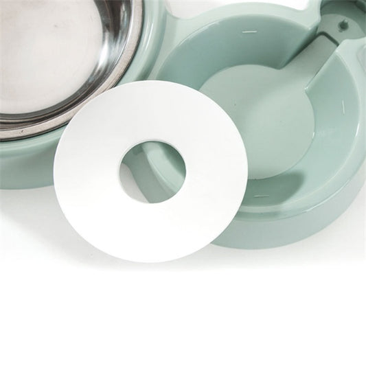 Close-up of a white circular object with a central hole, set against a light green background.