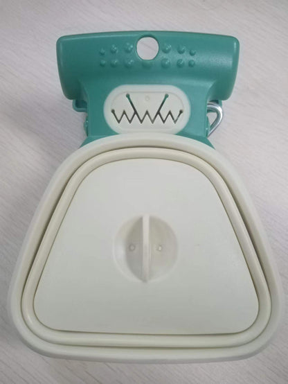 Teal and white pet muzzle on a light gray background