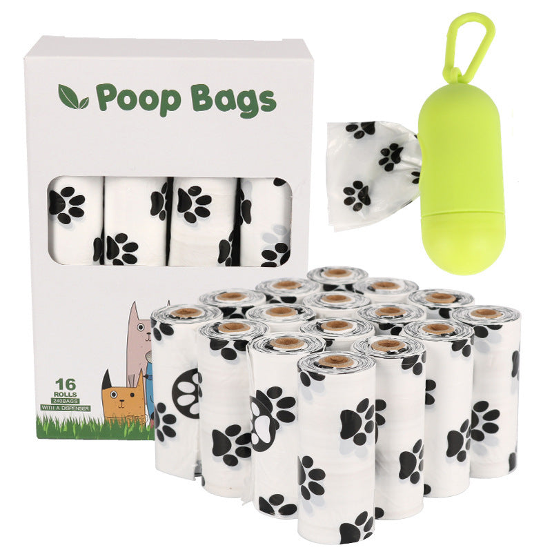 Dog poop bags with packaging and a green bag holder on a white background