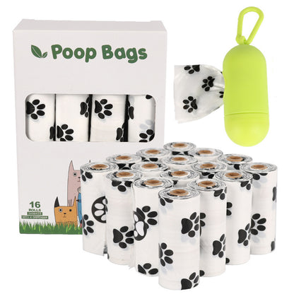 Dog poop bags with packaging and a green bag holder on a white background