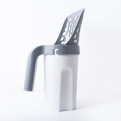 Cat litter scoop in a white background