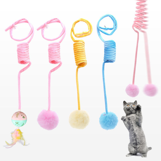 Colorful cat toys with springs and pom-poms on a white background, featuring a cat playing with one of the toys.